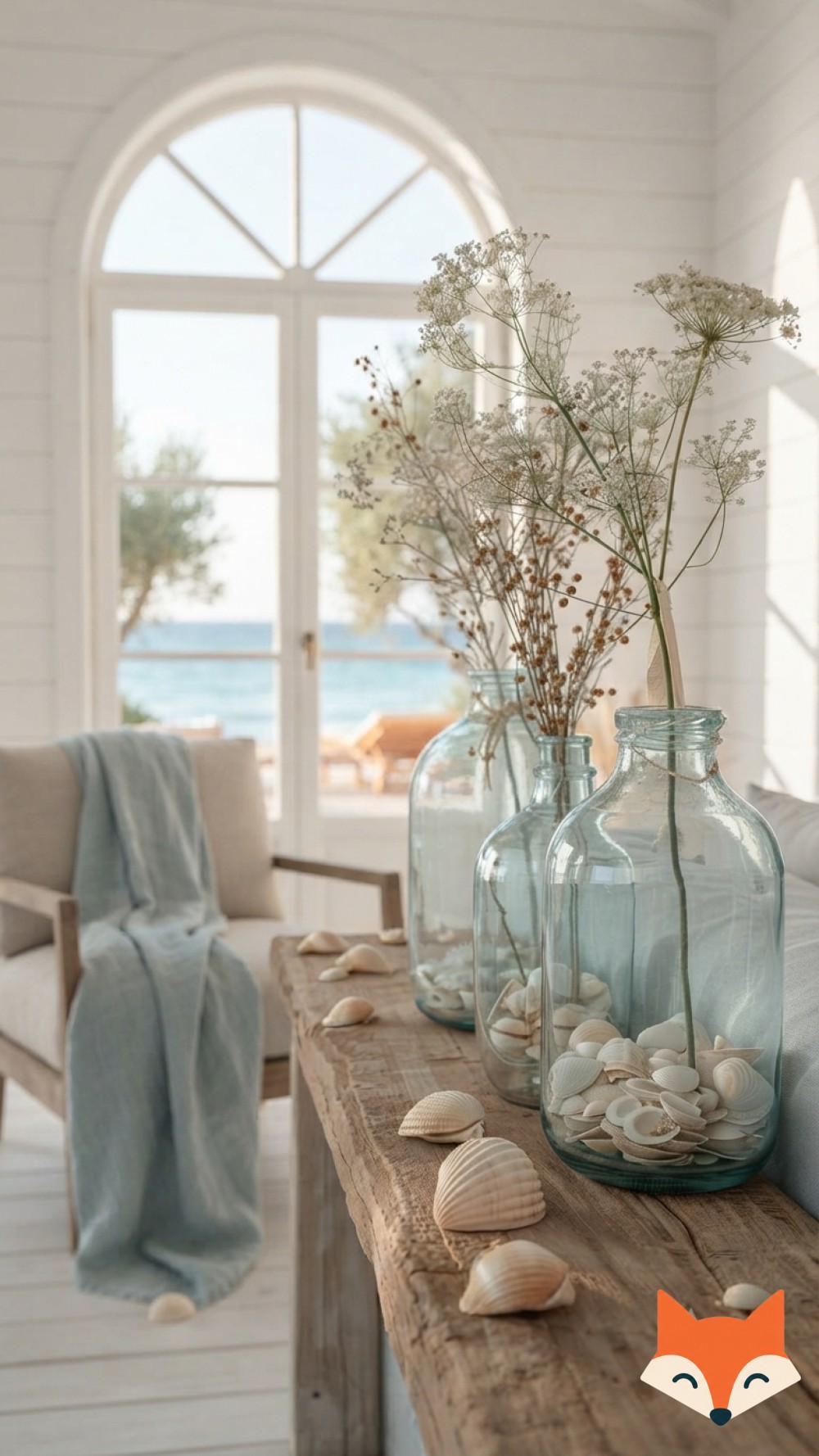 Nautical coastal bedroom decor idea with navy striped bedding, a rope mirror, and a brass ship lantern